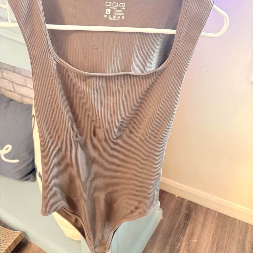 Three OQQ ribbed bodysuit.